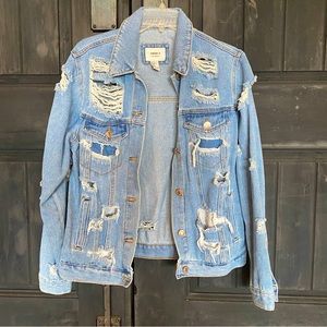 Distressed jean jacket. Womens size medium, loose style fit. Excellent condition